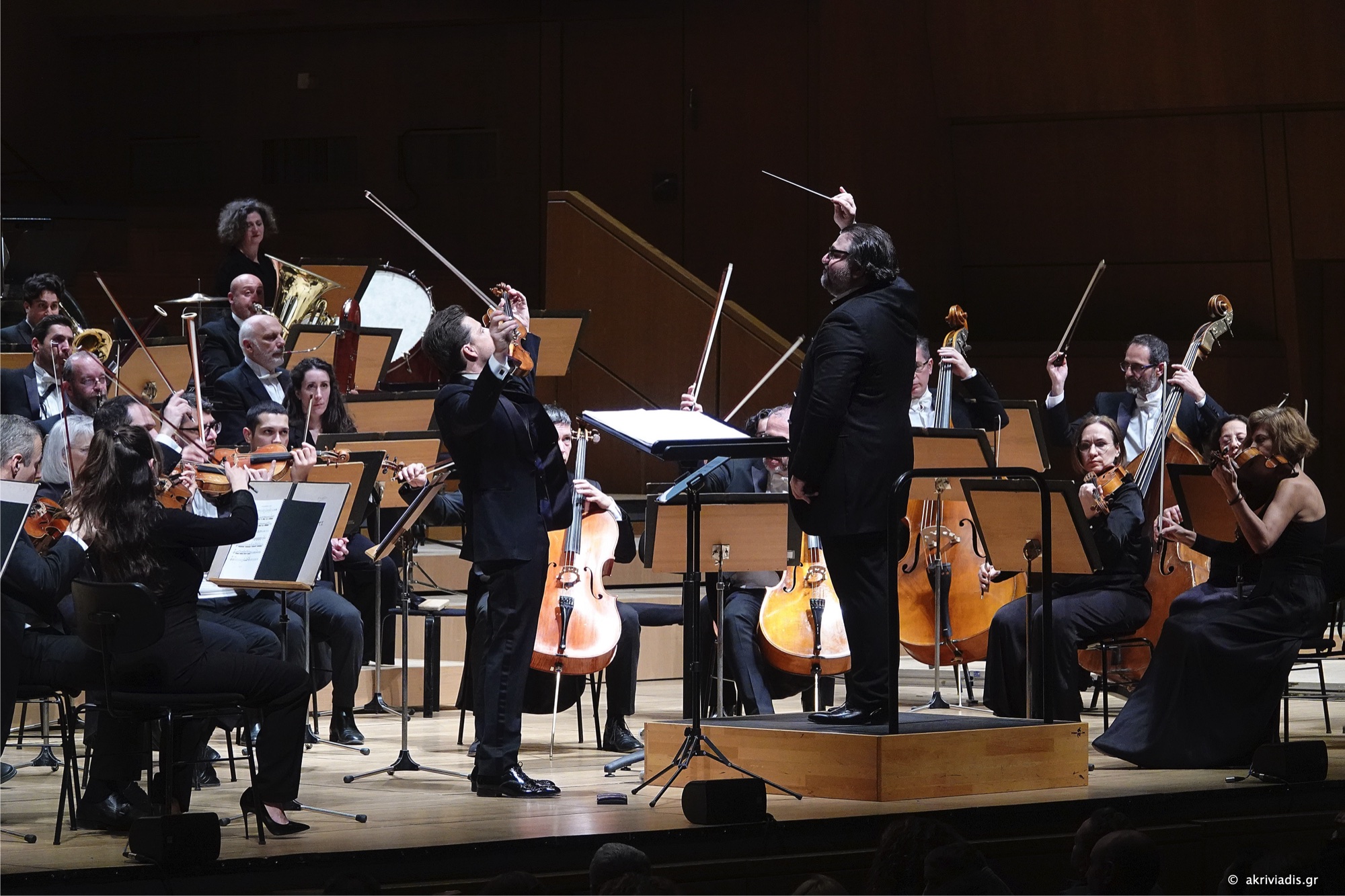 Georgios Balatsinos conducting with soloist and orchestra